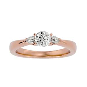 round cut pear shape side stone tapered plain band three stone engagement ring with 18k rose gold metal and round shape diamond